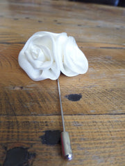 white flower lapel pin
