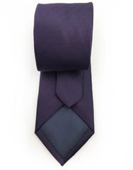 tip of dark purple herringbone necktie