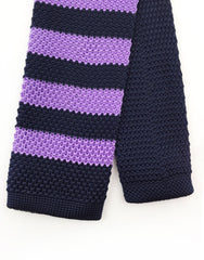 tip of purple black knit tie