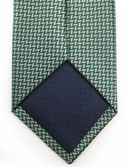 Tip of green silver herringbone tie