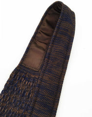 Neck view - brown and purple knitted necktie
