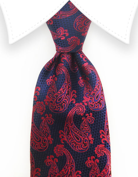 raspberry red paisley tie on navy and black background