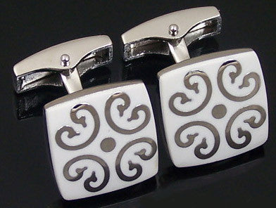 White cufflinks with silver design