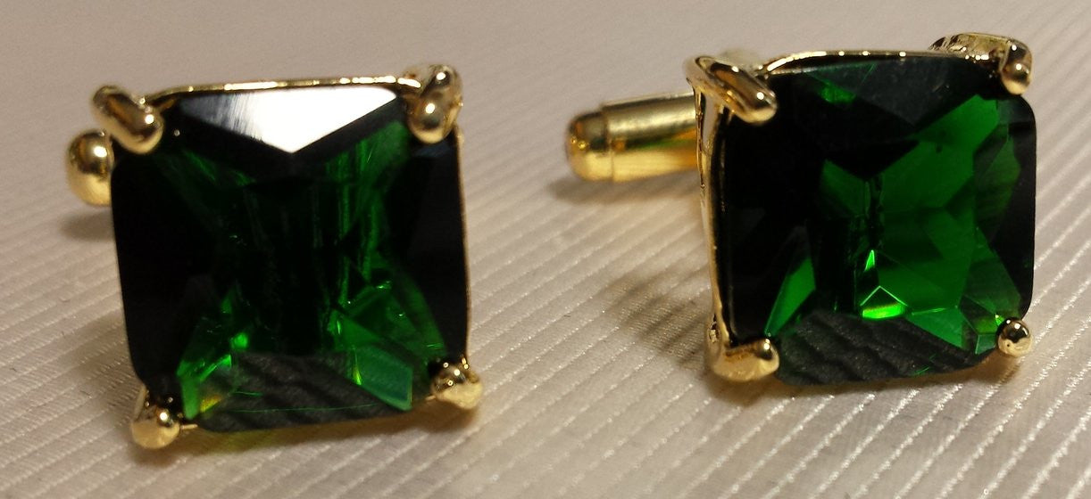 gold cufflinks with green stone