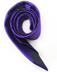 rolled up purple herringbone tie