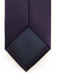 tip of dark purple tie