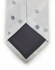 tip of white tie with silver flowers